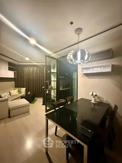 Modern living room with stylish dining area and cozy seating, perfect for urban living.