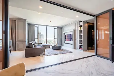 Luxurious modern living room with panoramic city views and elegant furnishings.