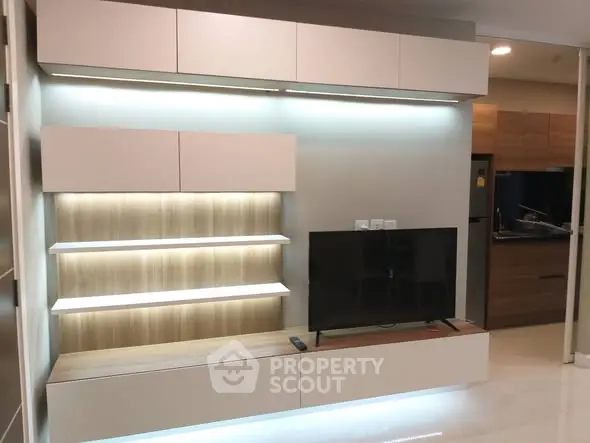 Modern living room with sleek TV unit and ambient lighting