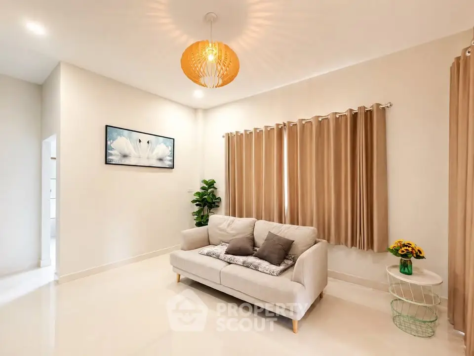 Modern living room with elegant decor and cozy sofa, perfect for relaxation.