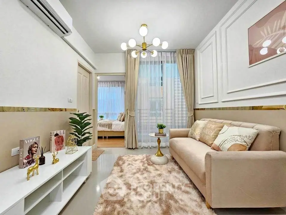 Stylish living room with modern decor and cozy ambiance, featuring elegant lighting and plush furnishings.