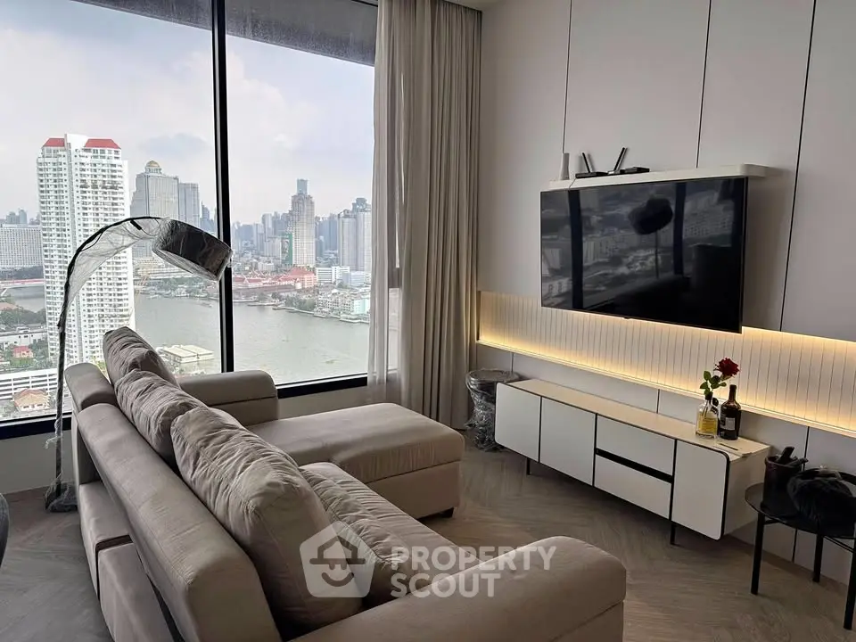 Luxurious living room with stunning city view, modern decor, and elegant furnishings in high-rise apartment.