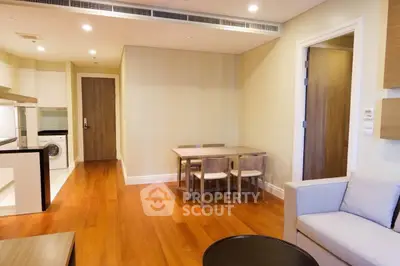 Modern apartment interior with wooden flooring and cozy dining area