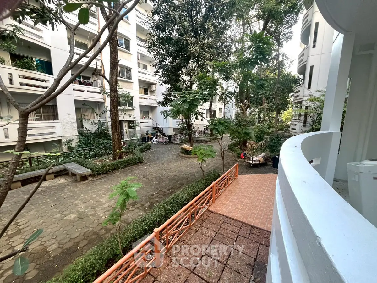 Charming garden view from balcony in residential complex