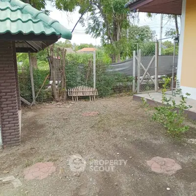 Charming rustic garden area with potential for landscaping and outdoor activities.