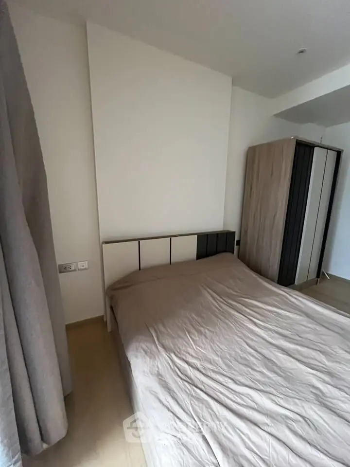 Cozy bedroom with modern wardrobe and neutral decor