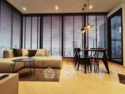 Stunning modern living room with panoramic city views and elegant furnishings.