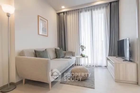 Modern living room with cozy sofa and stylish decor in bright apartment.