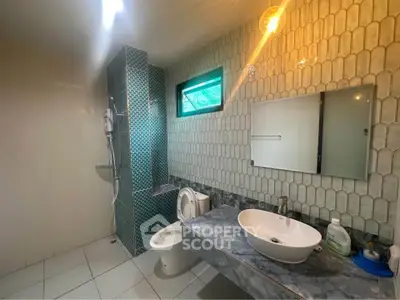 Modern bathroom with stylish tiles and contemporary fixtures