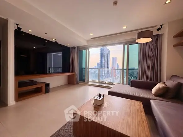Spacious modern living room with stunning city view and elegant furnishings.