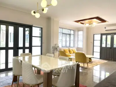 Spacious modern living room with elegant dining area and stylish lighting