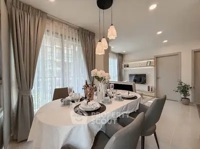 Elegant dining area with modern decor and natural light in a stylish apartment.