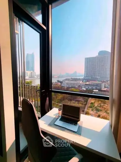 Stunning city view from a modern home office with balcony access, perfect for remote work.