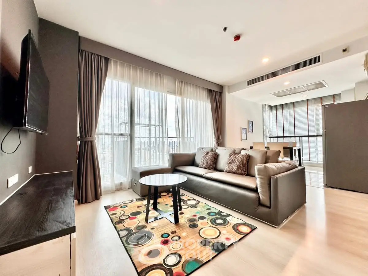 Spacious modern living room with large windows and stylish decor