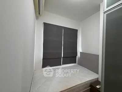 Cozy minimalist bedroom with air conditioning and modern blinds