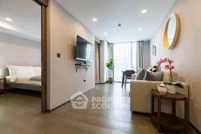 Modern open-plan living room with stylish decor and natural light