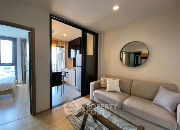Modern apartment interior with cozy living room and compact kitchen area