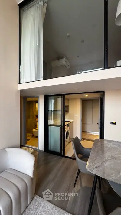 Modern duplex apartment with stylish interior and washing machine