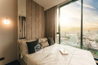 Luxurious bedroom with panoramic city view and elegant decor