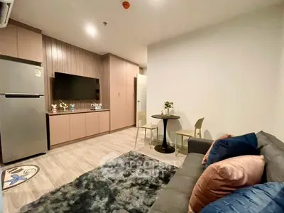 Modern living room with cozy sofa, stylish decor, and open layout in a contemporary apartment.