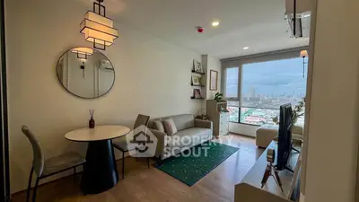 Modern living room with city view, stylish furniture, and elegant decor in a high-rise apartment.