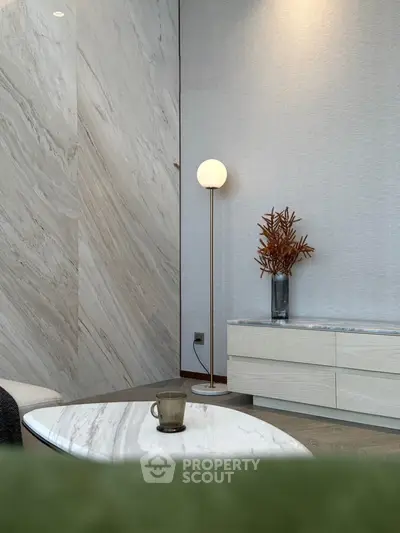 Elegant modern living room with marble accents and stylish decor