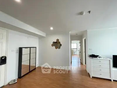 Spacious modern living room with wooden flooring and stylish decor