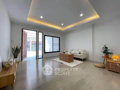 Spacious modern living room with elegant lighting and cozy furniture