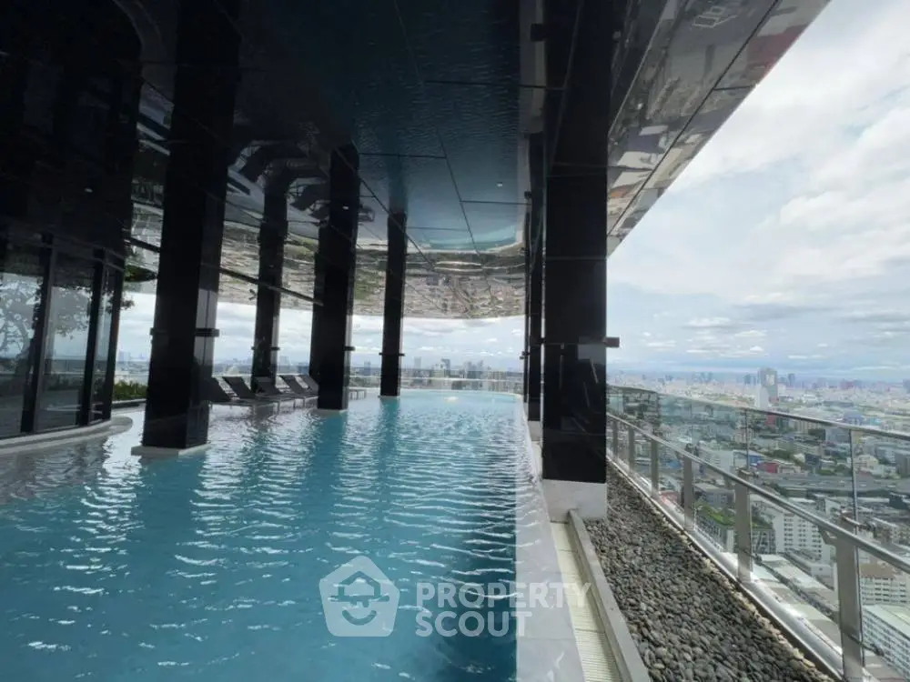 Luxurious rooftop pool with stunning cityscape view, perfect for relaxation and leisure.