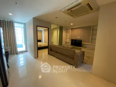 Spacious living room with modern furnishings and natural light