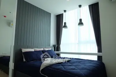 Modern bedroom with stylish decor and large window for natural light