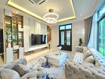Luxurious living room with elegant decor, plush seating, and large windows offering a serene garden view.