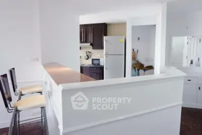 Charming kitchen with open layout and modern appliances in a cozy apartment.