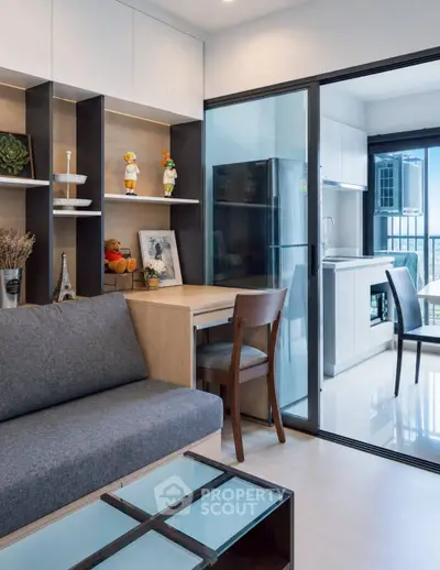 Modern living room with open kitchen and stylish decor in a contemporary apartment.