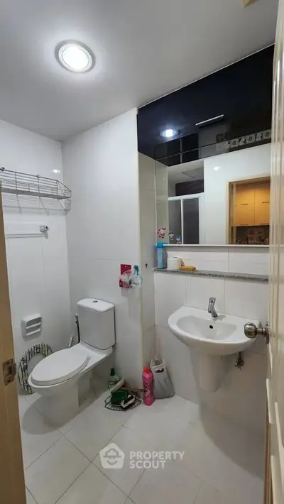 Modern bathroom with sleek fixtures and ample storage space