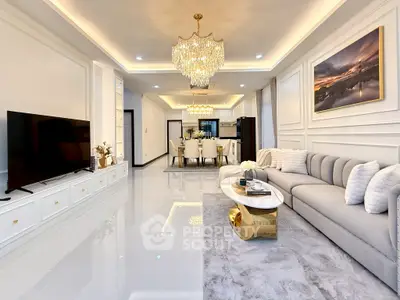 Luxurious living room with elegant chandelier and modern decor