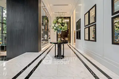 Luxurious building entrance with elegant decor and marble flooring