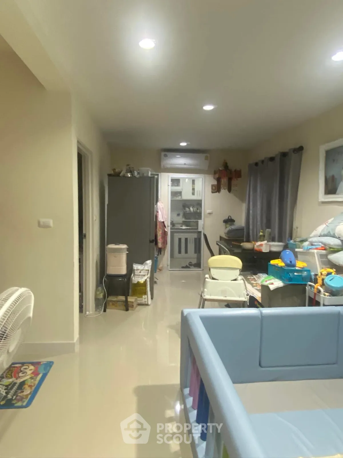 Spacious family living room with modern decor and ample natural light