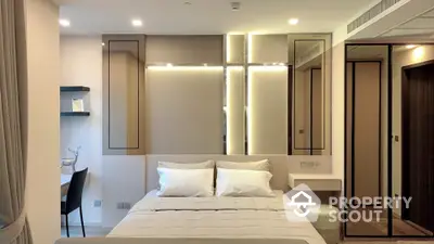 Modern bedroom with elegant lighting and stylish decor