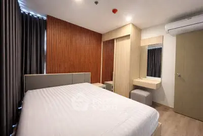 Modern bedroom with stylish wood paneling and cozy ambiance