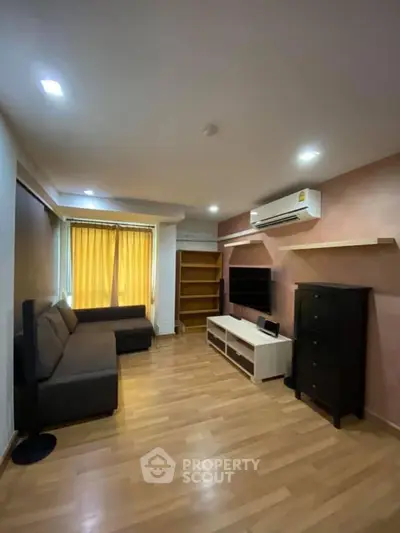 Spacious living room with modern furniture and wooden flooring