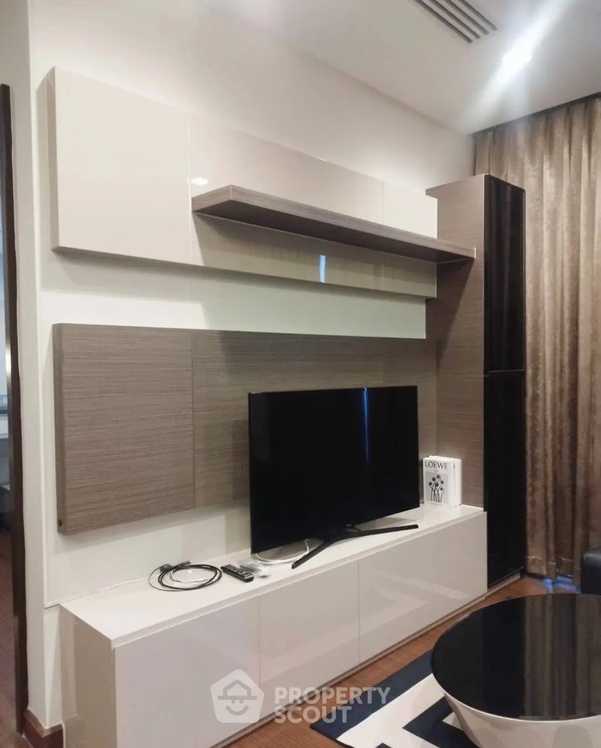 Modern living room with sleek TV unit and stylish decor