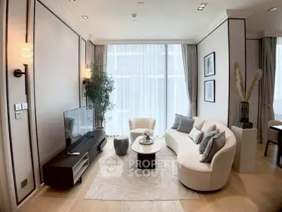 Luxurious living room with elegant decor and large windows in modern apartment.