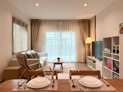 Modern living room with elegant decor, large window, and stylish furniture, perfect for relaxation and entertainment.