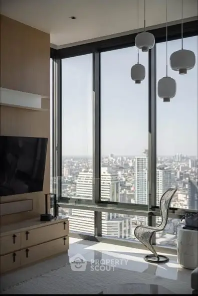 Luxurious modern living room with panoramic city view and stylish decor.