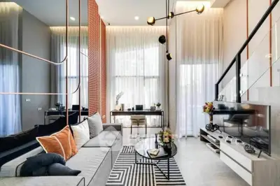 Modern living room with high ceilings and stylish decor