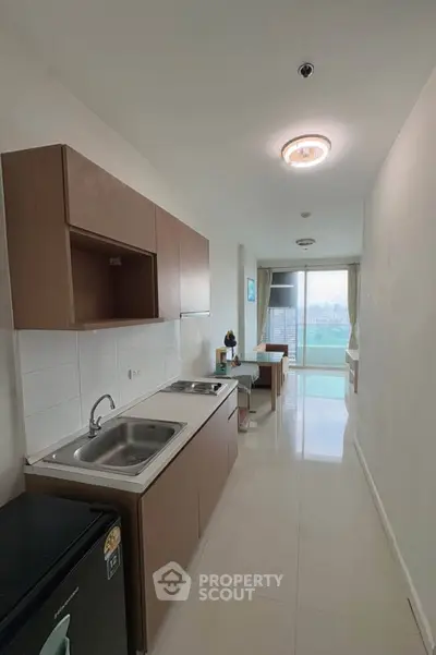 Modern kitchen with sleek cabinetry and open layout in a bright apartment