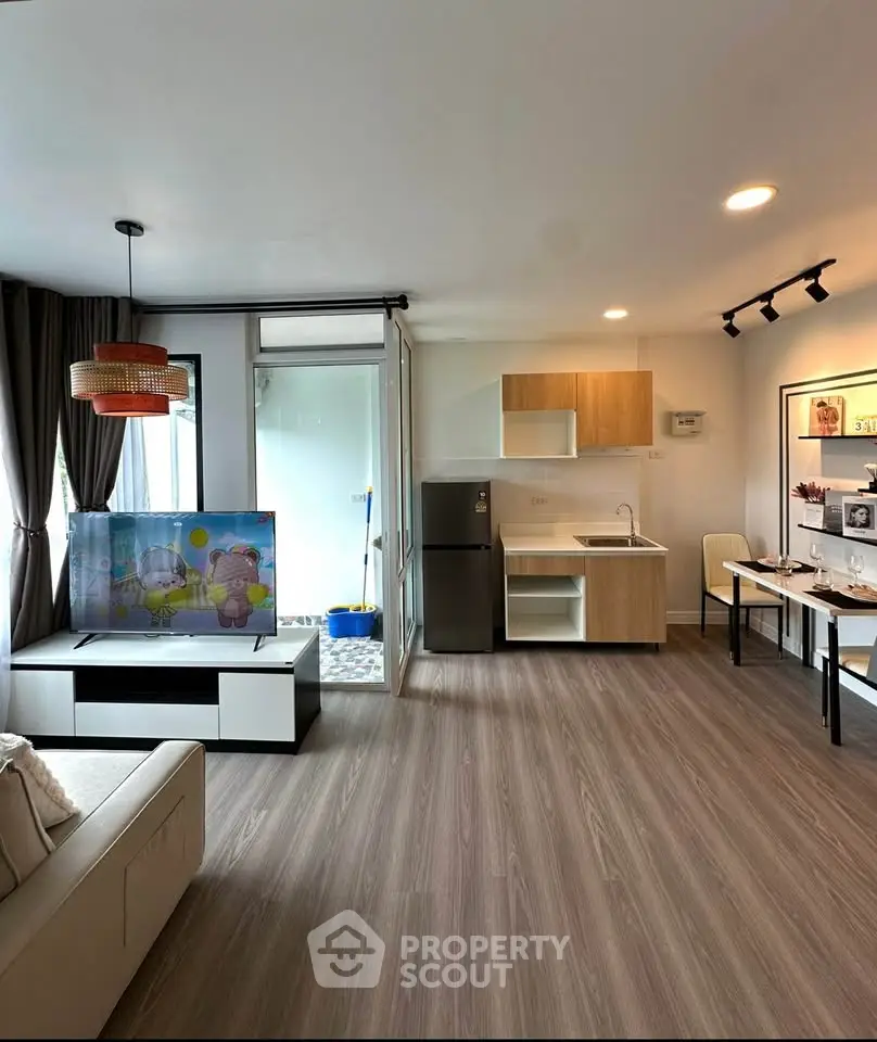 Modern living room with open kitchen and stylish decor