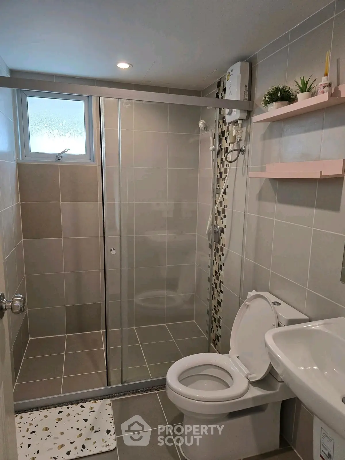 Modern bathroom with glass shower and sleek tile design