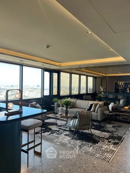 Luxurious high-rise living room with panoramic city views and modern decor.